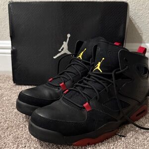 Black and Red Jordan Sneakers with Yellow Accents. Pristine condition